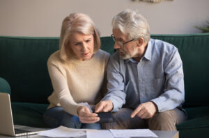 elderly couple reviewing their Annuities