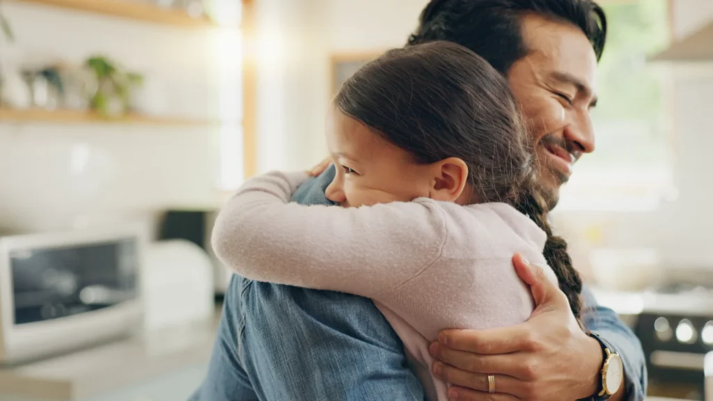 Father hugging daughter 