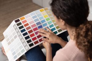 A woman looking a colour picker representing the Financial Personality Colour choice