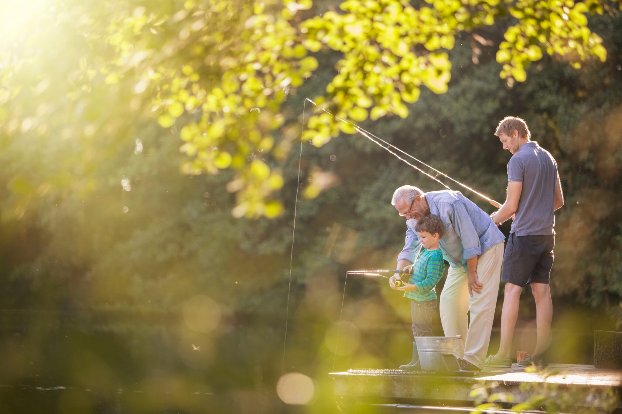 grandfather appreciating family time with son and grandson