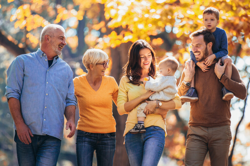 happy family going for a walk after getting protection insurance