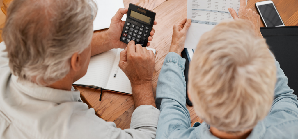 An older couple working out their state pension in relation to their finances after retiring abroad.